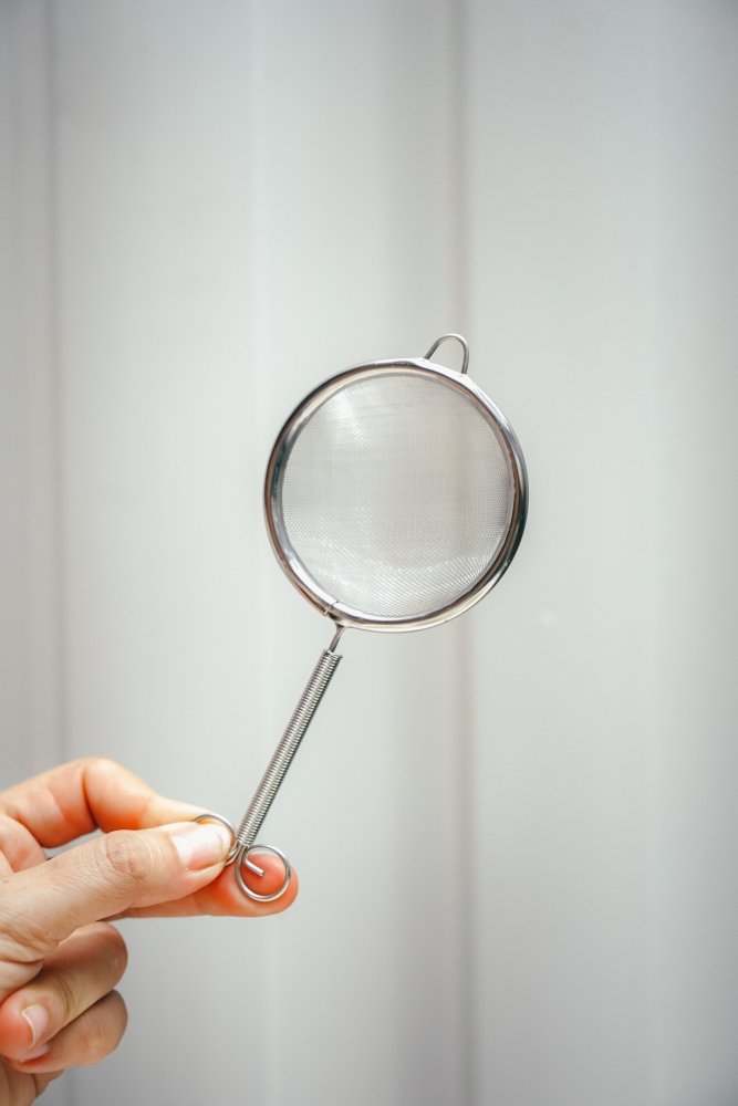 Matcha sifter close-up of stainless steel mesh